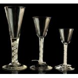 A small private collection of drinking glasses - a drawn stem glass with double series opaque