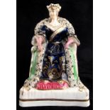 The Martin-Smith Collection of Victorian Staffordshire figures - Queen Victoria seated on her