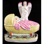 The Martin-Smith Collection of Victorian Staffordshire figures - an angel watching over a child in a