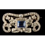 A sapphire & diamond floral openwork brooch, the central rectangular cut sapphire approximately 2.