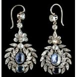 An unusual pair of sapphire & diamond pendant earrings in the form of laurel wreaths, each centred