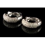 A pair of 14ct white gold diamond circlet earrings, the estimated total diamond weight approximately