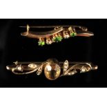 Property of a lady - a 15ct gold diamond & peridot or green tourmaline brooch, 4cms. long, boxed;