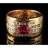 A heavy 18ct gold ring set with a rectangular cut natural ruby weighing approximately 1 carat,