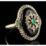 An 18ct white gold black onyx emerald & diamond ring, with oval setting, size N, approximately 10