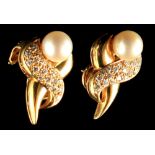 A pair of hallmarked 18ct gold earrings, each set with a cultured pearl, approximately 8mm diameter,