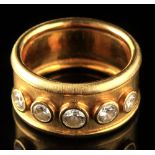Property of a lady - a modern graduated five stone diamond ring, in unmarked yellow metal gipsy type