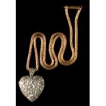 A heavy late 19th / early 20th century French gold heart shaped locket pendant set with diamonds,