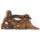 Property of a deceased estate - a European carved parcel gilt & painted wooden figure of a reclining