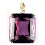 A very large amethyst pendant, the clear intense purple amethyst measuring approximately 31 by 27mm,