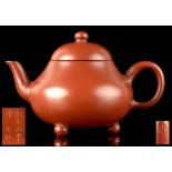 A small Chinese Yixing teapot, late 19th century, incised 7-character mark to underside and 3-