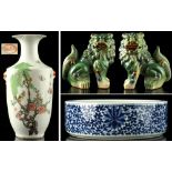A Chinese famille rose rouleau vase with moulded ring handles, painted with birds & butterflies