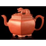 A Chinese Yixing hexagonal teapot, 18th / 19th century, with recumbent temple lion finial, the