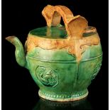 A Chinese sancai glazed teapot, probably late 19th, decorated in relief with octagonal panels of