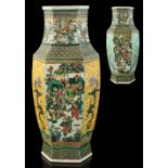 A large 19th century Chinese famille verte hexagonal baluster vase, painted with panels of figures