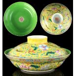 A Chinese lime green ground famille rose bowl & cover, iron red Qianlong 4-character seal marks