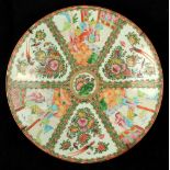 A late 19th century Chinese Canton famille rose charger, 16.2ins. (41cms.) dia. (see illustration).