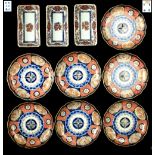 A set of seven late 19th century Japanese Imari shallow dishes, each 8.35ins. (21.2cms.) across;