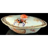 A Chinese lozenge shaped famille rose armorial tureen & cover, late 19th / early 20th century,