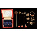 A bag containing assorted jewellery including an enamel ring set with diamond chips, and a hatpin