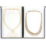 A modern 9ct gold fringe necklace, 17ins. (43cms.) long, approximately 18 grams, boxed; together