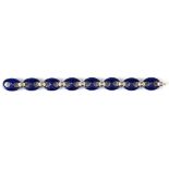 A modern 18ct white gold & dark blue enamel oval link bracelet, 7.5ins. (19cms.) long, approximately