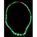 A Chinese graduated single row jadeite bead necklace, the largest bead approximately 14mm