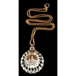 Property of a lady - a large carved rock crystal pendant set with round brilliant cut diamonds,