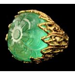 An Indian Mughal style emerald ring, the massive pale emerald weighing approximately 70 carats &