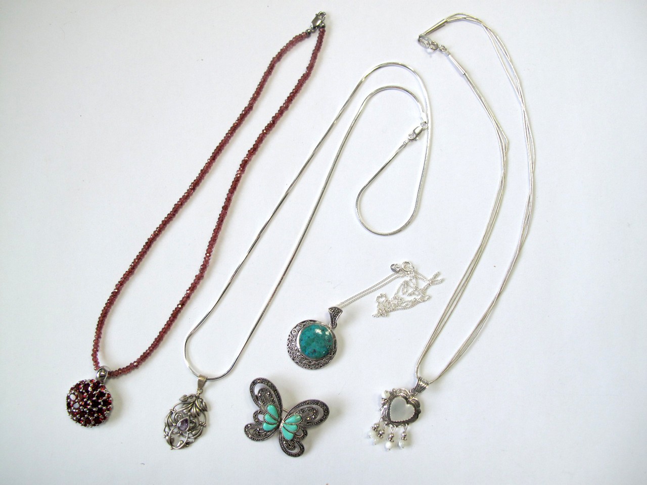 Jewellery - A Garnet Bead Necklace, suspending garnet cluster pendant, stamped "925", together