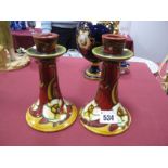 A Pair of Early XX Century Minton Pottery Candlesticks, of spreading circular section, tubelined and