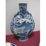 An Early XX Century Chinese Porcelain Moon Vase, moulded with dragons to the neck, blue and white