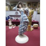 A Goldscheider Pottery Figure, depicting a young woman wearing a floral pattern summer dress and