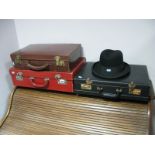Red and Brown Leather Suitcases, brief case, stationery folios, Tress Trilby hat.