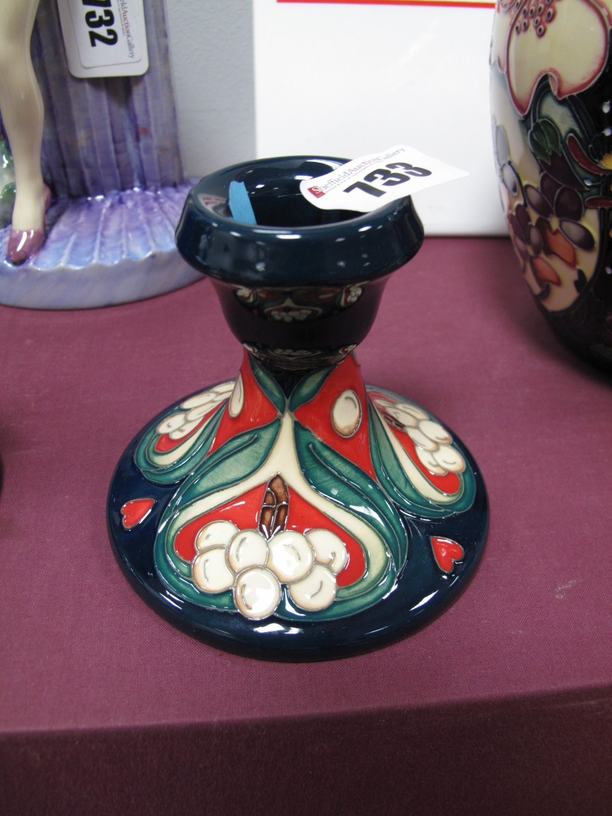 A Moorcroft Pottery Candlestick in the Golden Bough Design, from the Winter Legacy Collection, shape