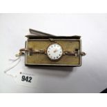 A 9ct Gold Cased Lady's Wristwatch, the white dial with black and red Roman numerals, within plain