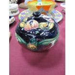A Moorcroft Pottery Circular Lidded Bowl in the Anna Lily design by Nicola Slaney, shape 147/5,
