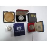 A 2008 UK Britannia One Tenth Ounce Silver Proof Coin. A 1977 silver proof coin. A year 2000 Cook