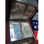 An Album of Some Thirty One Banknotes, GB and foreign. Twelve British Armed Forces vouchers.