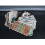 A Small Collection of Banknotes and British Armed Forces Vouchers, regularly of WWII vintage and