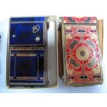 Two Art Deco Style Ladies Compacts in the Vintage Camera Style, one is blue enamelled with musical