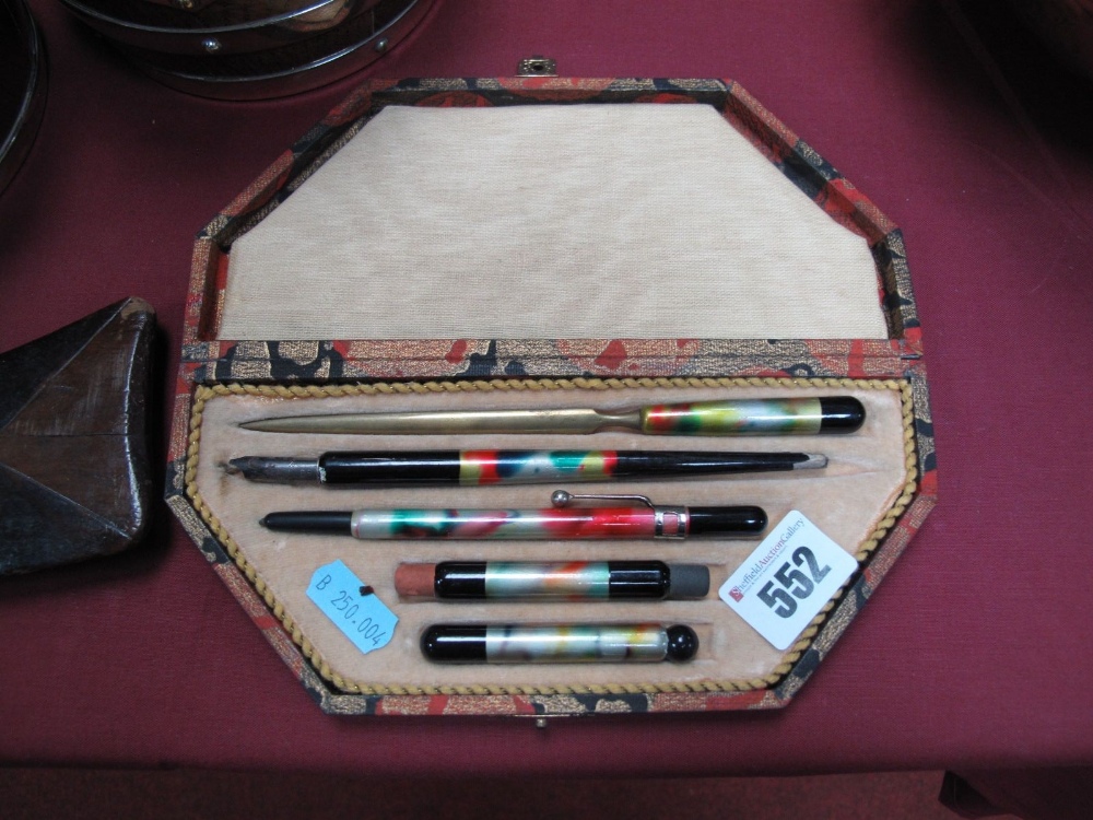 An Art Deco Period Pen Set, the five implements with multicoloured handles, in case.