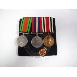 A WWII Duo of War Medal and Defence Medal, plus a QEII Special Constabulary Faithful Service medal