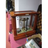 An L. Oertling Balance Scale, in glazed mahogany case, with accessories.