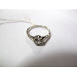 A Single Stone Diamond Ring, the old-cut stone claw set between diamond set shoulders, stamped "Fine