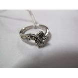 A 9ct White Gold Diamond Set Dress Ring, of crossover design, claw set to the centre with two