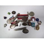 A Quantity of WWI and WWII Button Hole Badges, including "On War Service" 1914, "On National