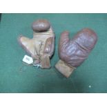 A Pair of Child's Leather Boxing Gloves, circa 1930's, heavily stitched, with lace ties. No