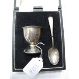 A Hallmarked Silver Egg Cup and Spoon, engraved, in fitted case.