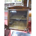 An Early 1900's Oak Slope Front Shop Advertising Cabinet, with pediment, gilt lettering to the